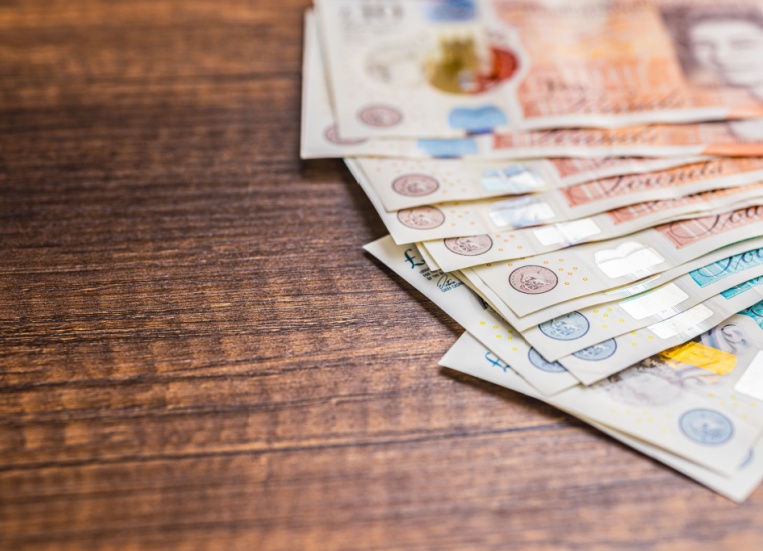 UK bank notes on a table.